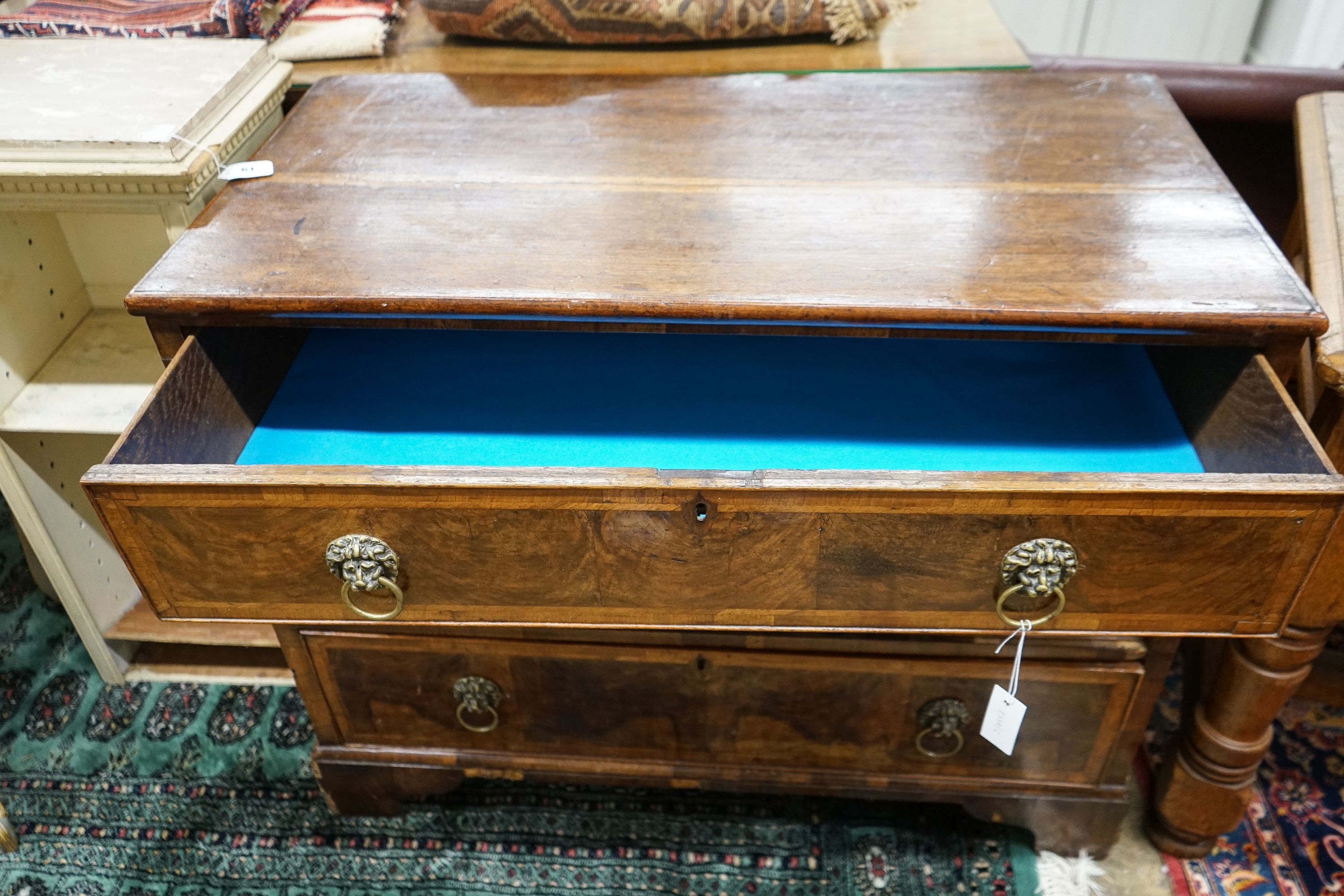 A walnut and oak chest of drawers, width 103cm, depth 52cm, height 82cm